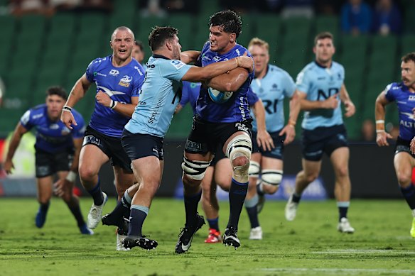 Darcy Swain is tackled