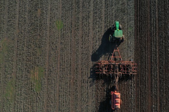 A tractor pulling a seeder to plant the winter crop in Balliang, Victoria. 