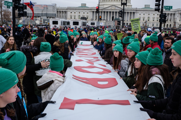 Pro-life demonstrators hold a banner during the March for Life 2020 rally in Washington as Trump became the first US President to attend the event.