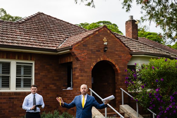 Auctioneer Jason Keen leads the auction.