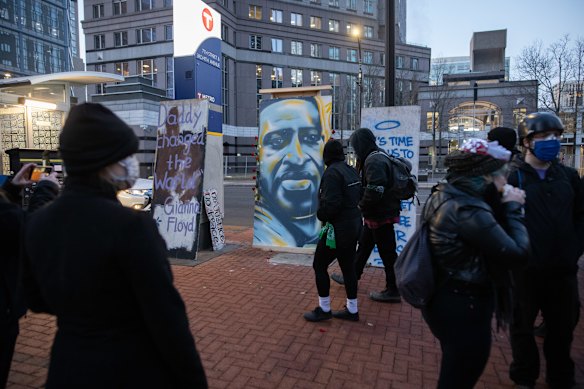 Demonstrators gather outside Hennepin County Government Centre in Minneapolis on Monday, local time.