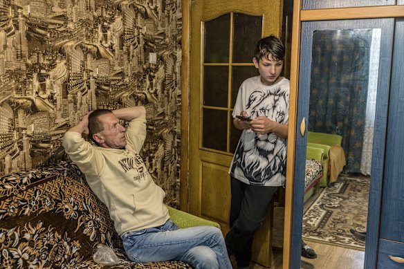 Anatolii and his father Volodymyr Poltoratskyi in their relatives’ apartment in the regional capital, two hours south of their village.