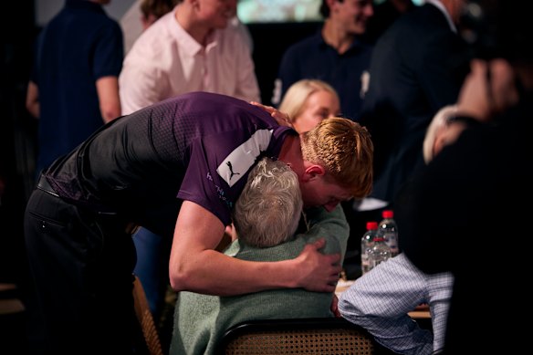 Harry Dean celebrates with his family at the draft. 