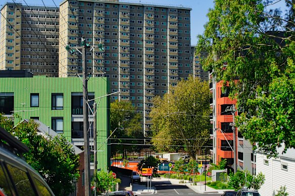 The Flemington towers stand behind new Homes Victoria housing built on Victoria Street.