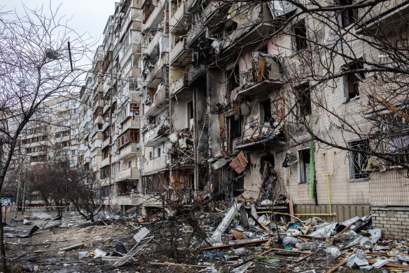 A fire damaged building following a blast during Russian artillery strikes in Kyiv.