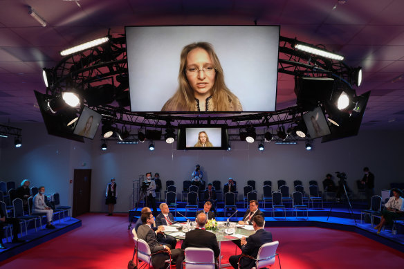 A screen displays Katerina Tikhonova, daughter of Russian President Vladimir Putin, as she speaks via video link at the St Petersburg International Economic Forum last year. 