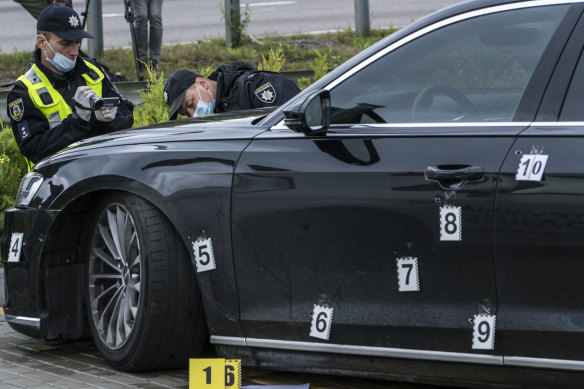 Police examine the car after an apparent assassination attempt against Serhiy Shefir, a top adviser to President Volodymyr Zelensky, on September 22, 2021 in Kyiv, Ukraine.