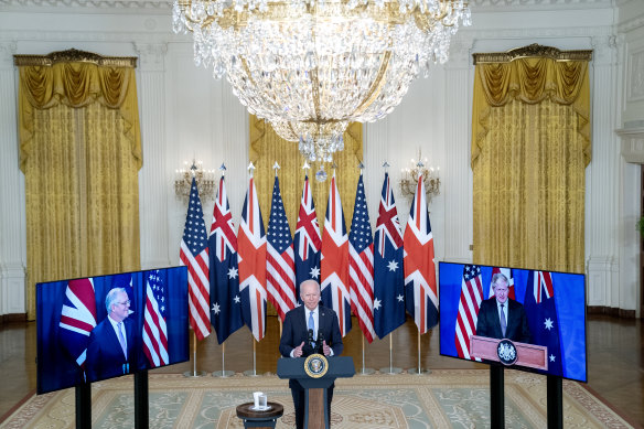 US President Joe Biden virtually alongside British Prime Minister Boris Johnson and Australian Prime Minister Scott Morrison in the East Room of the White House.