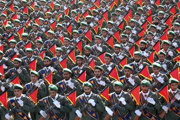 In this September 21, 2016, file photo, Iran’s Revolutionary Guard troops march in a military parade in Tehran, Iran. 