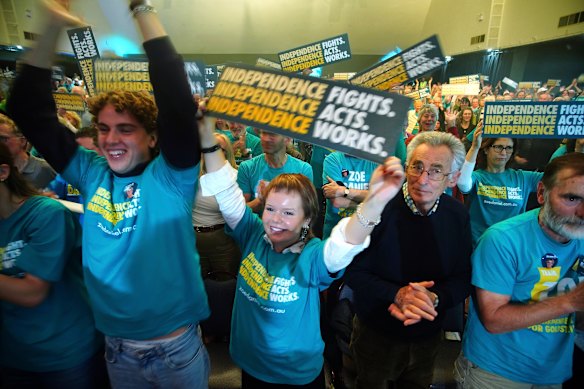 Supporters cheer for Zoe Daniel at her campaign launch.