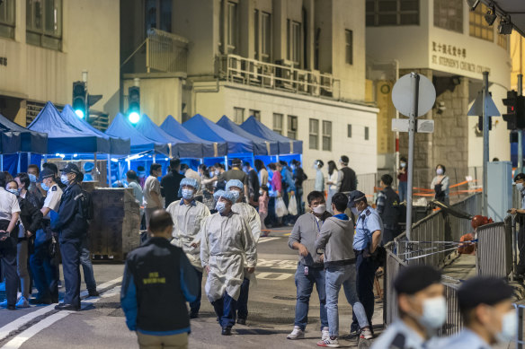 Government workers wearing personal protective equipment in Hong Kong. 