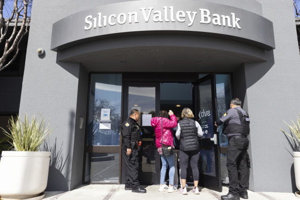Depositors are let into the headquarters of Silicon Valley Bank on Monday.