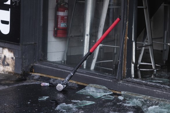 A sledgehammer and a small purple blowtorch rest at the scene of a break-in and arson attack in Collingwood.