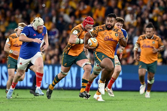 Big man on the break: Taniela Tupou takes off.