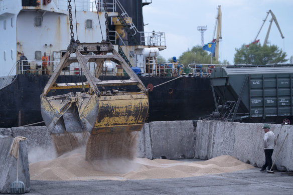 Workers load grain at a grain port in Izmail, Ukraine, in April.