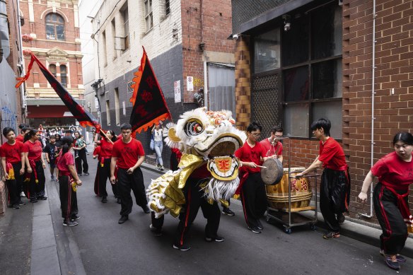 The Chinese Masonic Society Lion Dance Team perform a practice parade in Chinatown, January 2023.