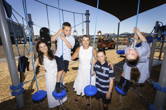 Mary Queen of Heaven Primary School principal Renae Gentile (centre), deputy principal Daniela De Luca and students Adam, 9, Amelia, 10, and Livinia, 6.