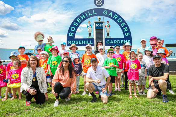 Hugh Bowman and Chris Waller with the kids from Camp Quality in front of the winning post at Rosehill.