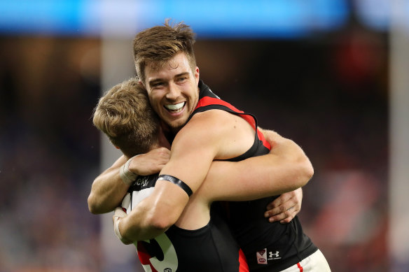 Jake Stringer and Zach Merrett celebrate a goal against the Eagles.