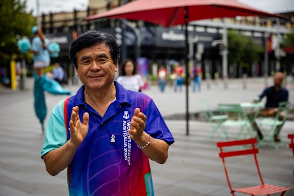 Joon Shik Shin watches a performance of Su Hee Cho & Co, a traditional Korean percussionist group, during a celebration of the 2026 Women’s Asian Cup in Parramatta Square.