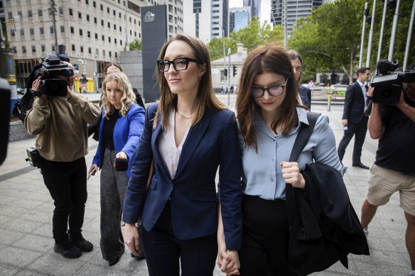 Political staffer Sally Rugg (left) arrives at Federal Court with her partner, actor Kate McCartney.