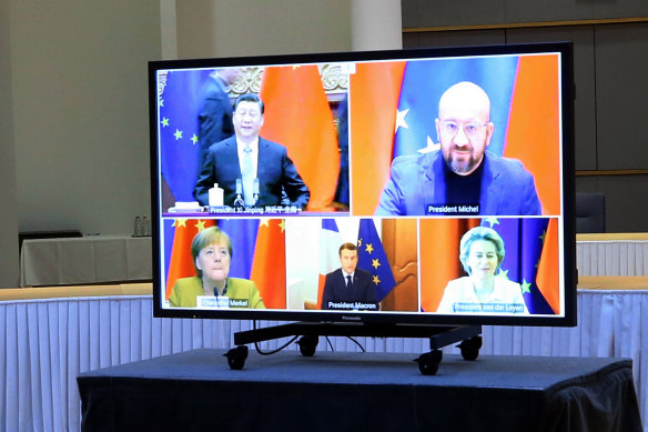 Clockwise from top left: Chinese President Xi Jinping, European Council President Charles Michel, European Commission President Ursula von der Leyen, French President Emmanuel Macron and German Chancellor Angela Merkel during their conference call on Wednesday to finalise a new EU-China investment accord.