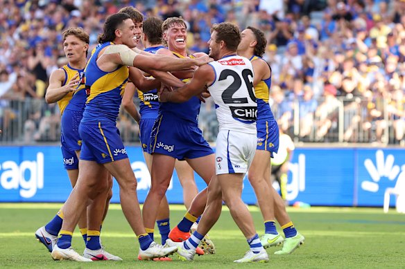 Fighting it out: Eagle Harley Reid and Kangaroo Luke Parker.