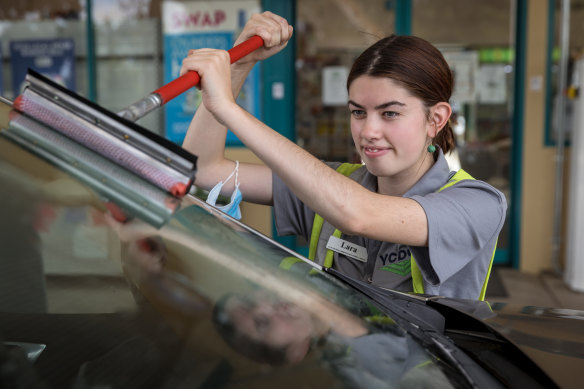 Staff member Lara Johnson working at the petrol station. 