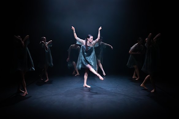 The balletic poses contrast with modern dance gestures as everything whirls together amid the smoke.