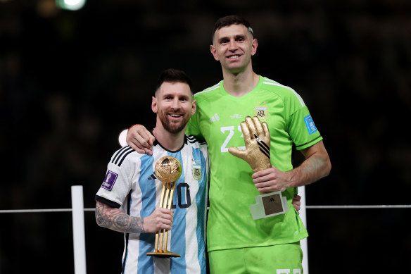 Emiliano Martínez and Lionel Messi at the award ceremony after Argentina’s World Cup win in 2022.