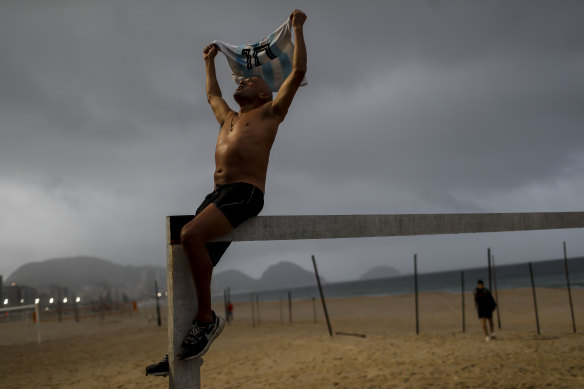 An Argentina fan celebrates on Rio de Janeiro’s Copacabana beach.