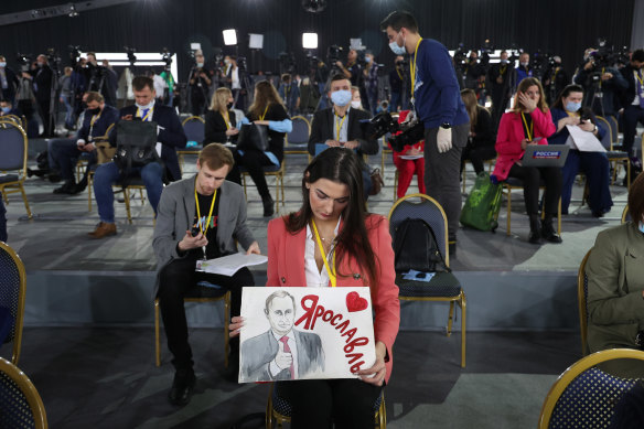 This was the first time in two years that Vladimir Putin had fronted the international press, and reporters had to hold up signs to get his attention. 