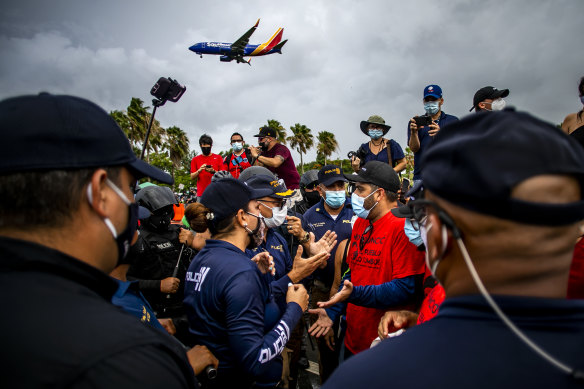 Fearing infection, demonstrators at Luis Munoz Airport in San Juan, Puerto Rico on Saturday protest against the arrival of tourists from the US mainland.