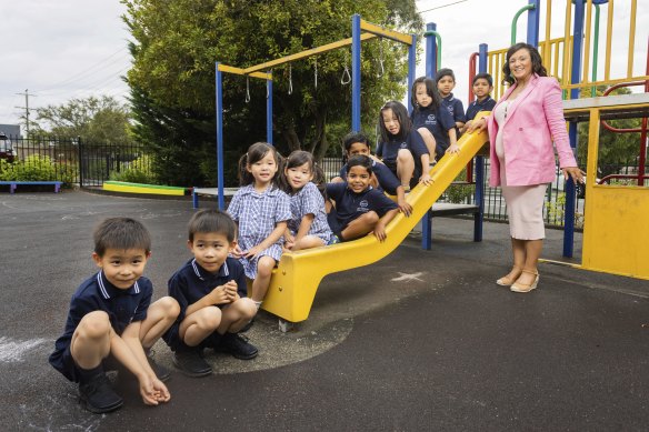 McKinnon Primary School acting principal Suzanne Khatib with five sets of identical twins starting prep on Tuesday. From left: Yi and Ze Yang; Leah and Vivienne Xue; Ruban and Rohan Patel; Theodora and Dorothy Ying; and Navil and Neev Shah.