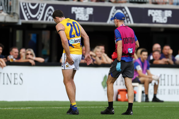 Jeremy McGovern hobbles off the field on Sunday.