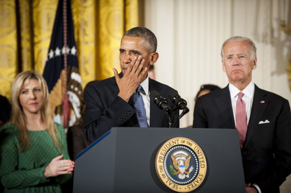 Then-US vice president Joe Biden looks on as then-US president Barack Obama wipes away a tear during remarks on gun control in 2016.