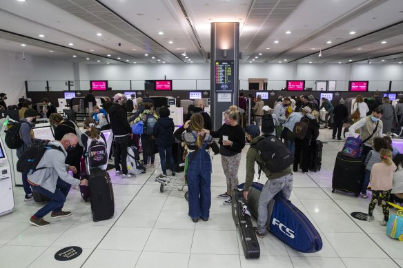 Passengers at Melbourne Airport Terminal 3. A Virgin Australia flight attendant who has since tested positive had been on various flights around Australia.