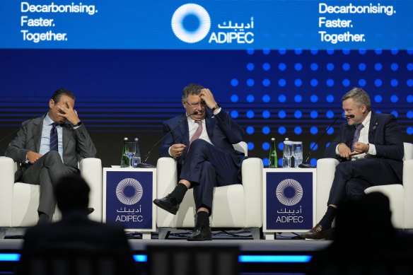 Wael Sawan, Shell CEO (left), Patrick Pouyanne, Total CEO, and BP interim CEO, Murray Auchincloss (right), take part in a panel at the oil and energy conference in Abu Dhabi.