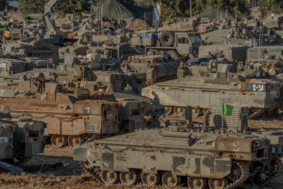 Israeli armoured vehicles gather in Upper Galilee, Israel, on the Lebanese border.