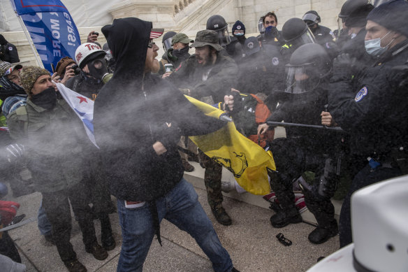 Pepper spray is used as demonstrators battle with US Capitol police officers while breaching the Capitol building grounds in Washington, on Wednesday.