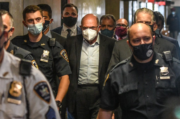 Allen Weisselberg, chief financial officer of Trump Organisation, centre, walks towards a courtroom in New York.