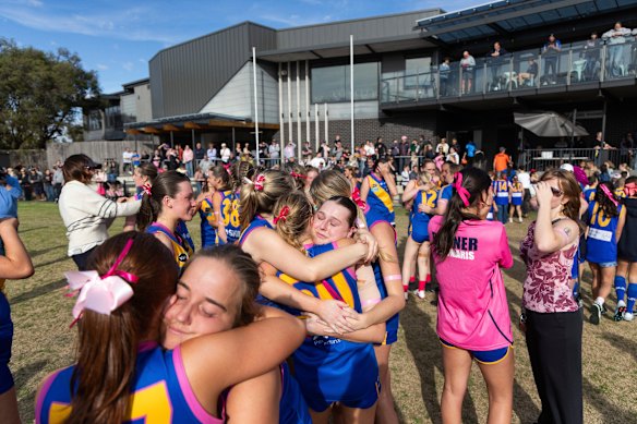 Players embrace before the game. 