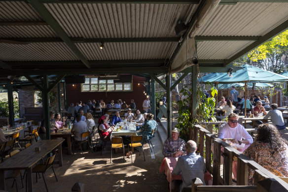 The hotel is a mixture of indoor and outdoor dining areas.