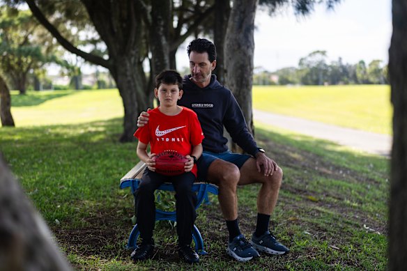 Harry Loebenstein with his son Oscar, 10, who suffered a concussion playing football last year.