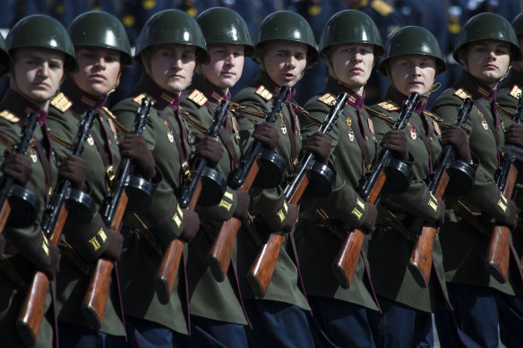 Russian Army officers dressed in Red Army World War II uniforms and holding PPSh-41 sub-machineguns march along Red Square during a rehearsal on May 7 last year for the Victory Day military parade in Moscow.