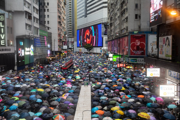 Tens of thousands of demonstrators march during a protest in the Causeway Bay district of Hong Kong, China, on Sunday.