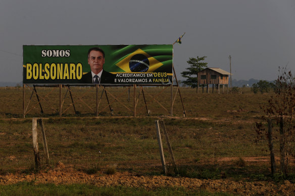 A billboard supporting Brazilian President Jair Bolsonaro at the entrance of a farm in the municipality of Humaita, Amazonas state, Brazil, where deforestation is rife.