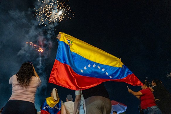 Venezuelan citizens watch fireworks during a rally on the Colombia-Venezuela border after the confirmation of Nicolas Maduro’s capture.