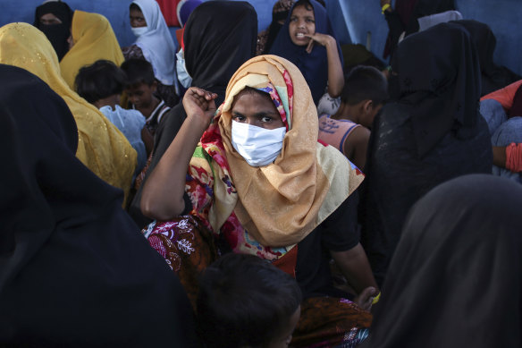 A newly arrived ethnic Rohingya woman, part of a group who was denied landing a few times by local residents, rests with others at a temporary shelter in Bireun, Aceh province, Indonesia, last month.