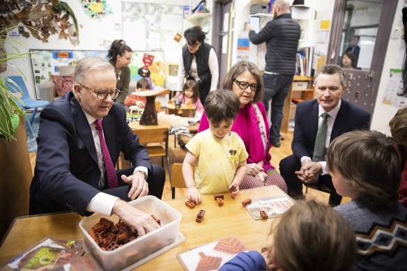 Prime Minister Anthony Albanese (left) and Education Minister Jason Clare (right) at a childcare centre last year. Any changes to childcare will put a strain on the federal budget.